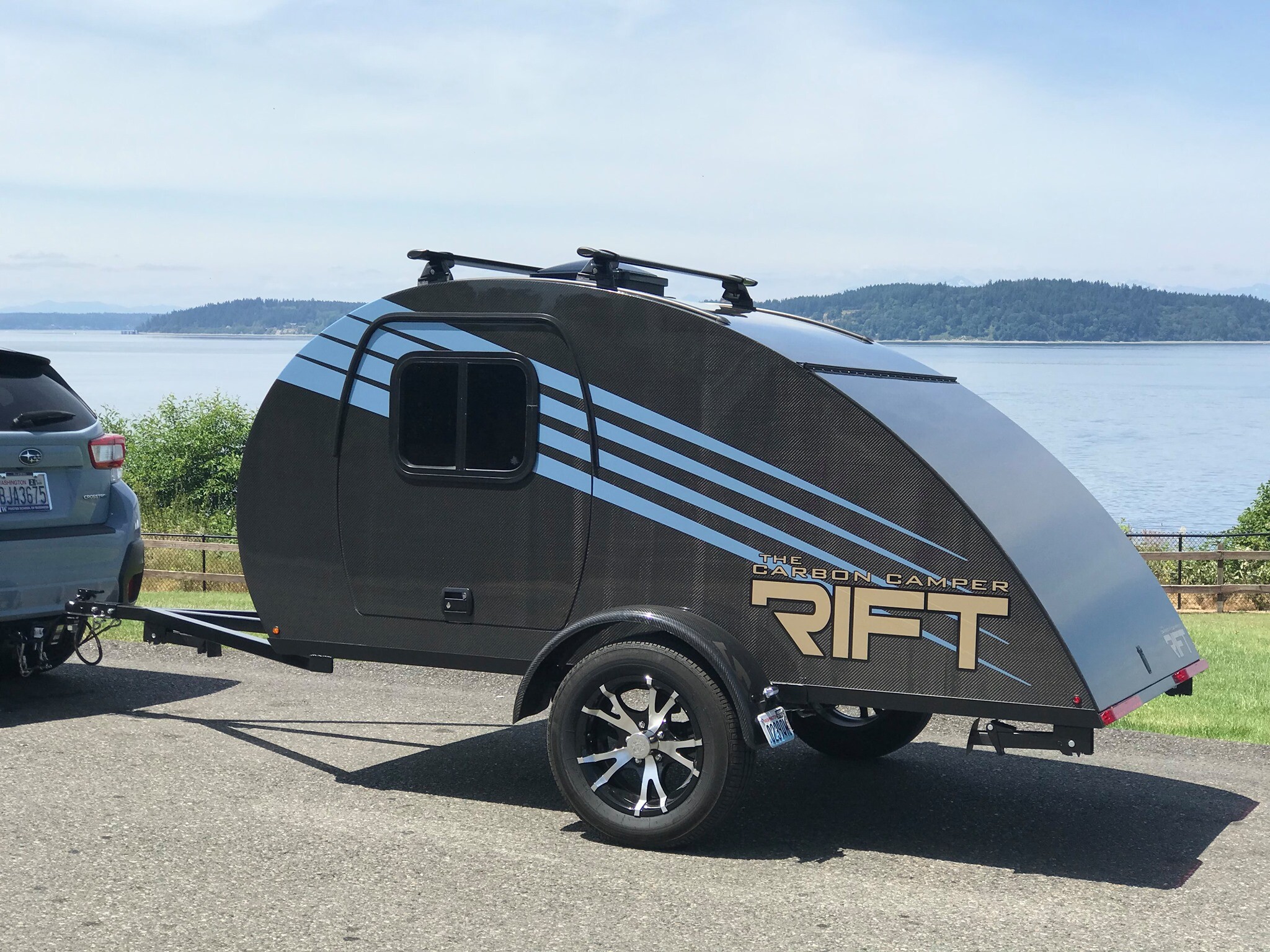Ultralight carbon teardrop utility camper tows via EV or motorcycle